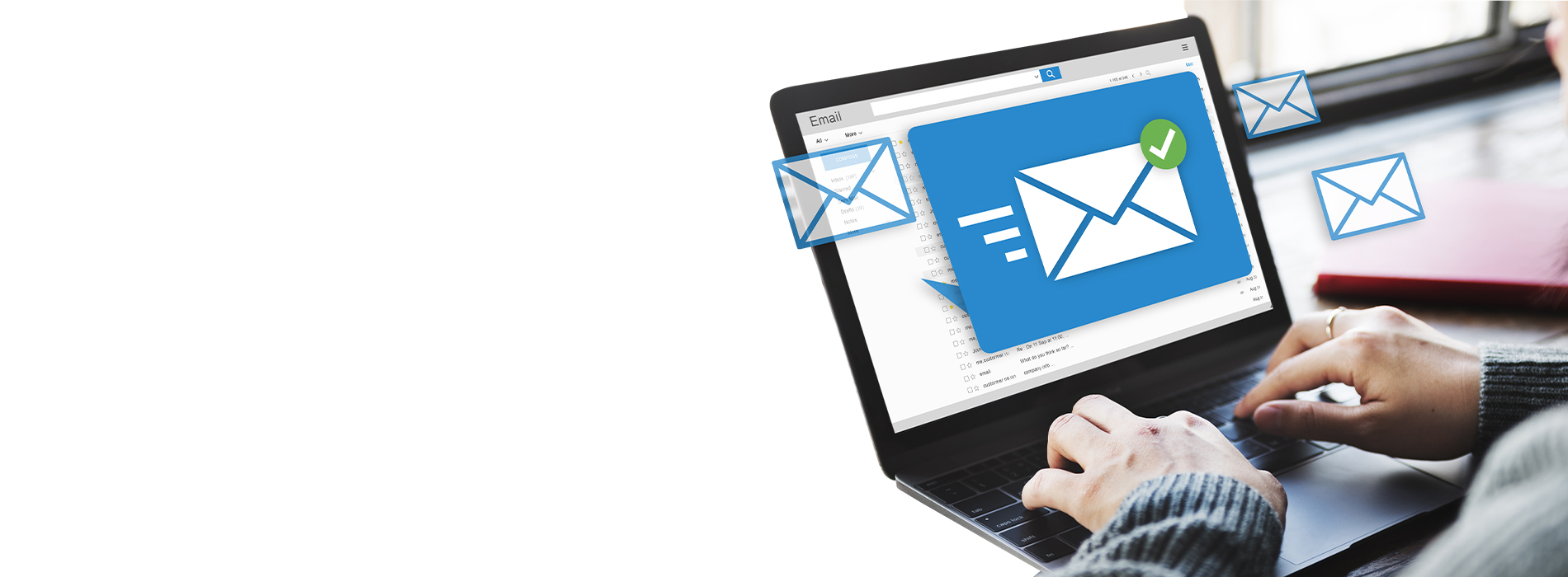 A person using a laptop with an email open, displaying an envelope icon and the text  email .